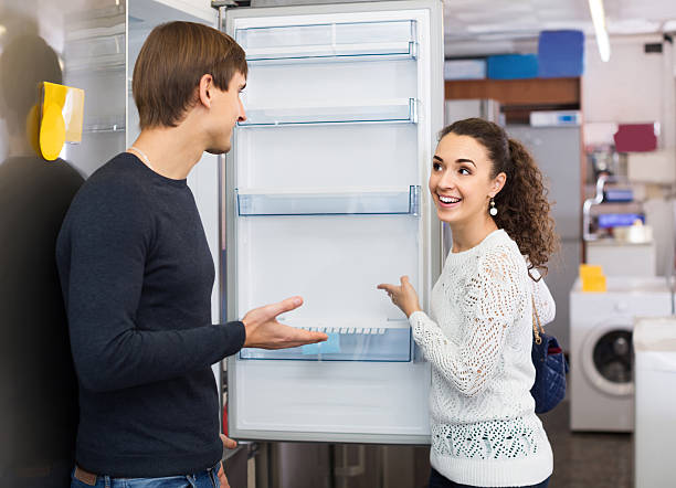 istock family couple choosing new refrigerator in hypermarket 542958566