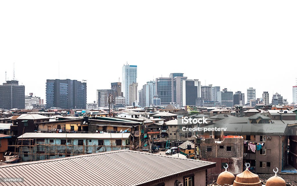 African city skyline - Lagos, Nigeria. African city skyline. Small mosque in the front. Lagos - Nigeria Stock Photo