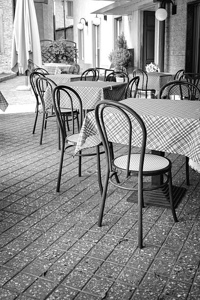 Tables and chairs. Black and white photo stock photo