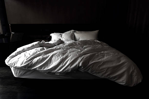 istock View of an unmade bed, Messy bed concep 542962974