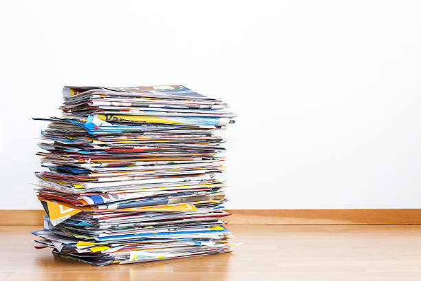 istock Tall pile of newspaper advertisements 542964266