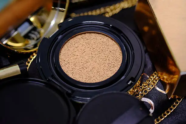 Photo of cosmetics gold set for background.  (Selective focus)