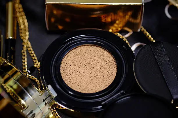 Photo of cosmetics gold set for background.  (Selective focus)