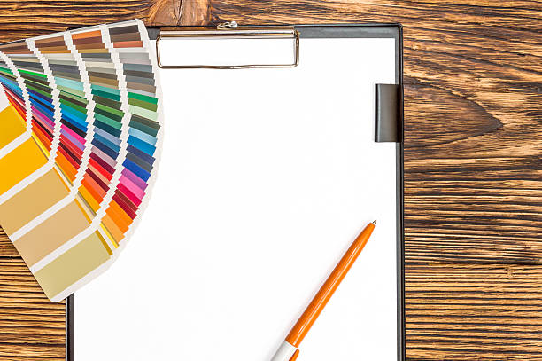 istock Color swatches book with pen on empty sheet 542969640