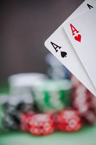 winning aces cards in poker game, blurred background