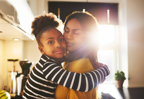 Loving child hugging mother