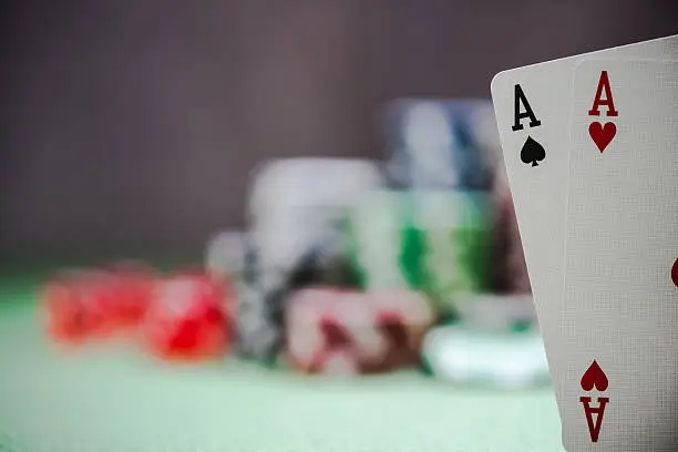 two winning aces in poker, casino background