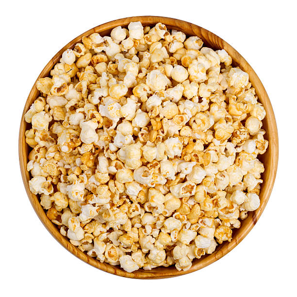 istock Popcorn in a wooden bowl on a white background 542970608
