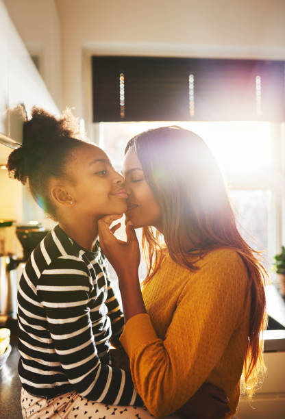 istock Loving mother kissing child 542970786