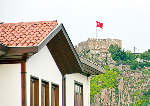 Ankara, Turkey - May 22, 2016: Ankara Castle is a fortification from ancient or medieval era in Ankara, Turkey. The exact date of its construction is unknown. Having been controlled by Romans and Byzantines earlier; it was captured by Seljuq Turks in 1073, by Crusaders in 1101, who gave it back again to the Byzantine and again by Seljuqs in 1227. The castle saw extensive repair by the order of İbrahim Paşa in 1832 during the Ottoman era.The ramparts of the old Ankara citadel nowadays serves as historic museum, tourists like to walk her, Ankara. There is a clear city view of Ankara from castle hill. People who go to Ankara first see the castle.
