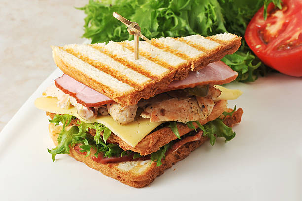 istock sandwiches with lettuce, ham, cheese, chicken breast 542972270
