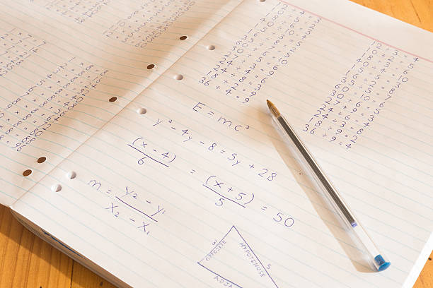 istock Mathematical sums written on pad paper 542973652
