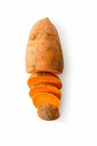 High angle view of one sweet potato, half sliced up.