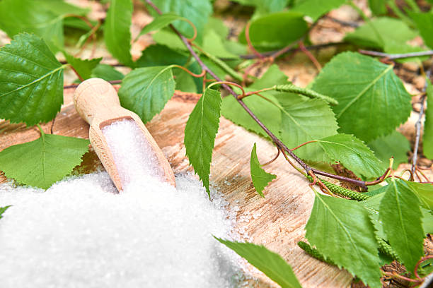 istock Xylitol birch sugar on a birch background 543042902
