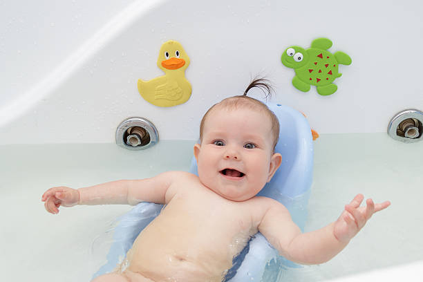istock Newborn baby bathe and swim 543043394