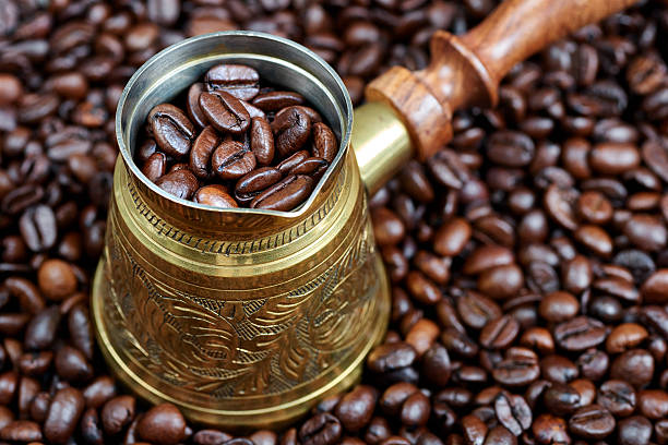 istock Coffee beans in a turkish coffee pot 543043464