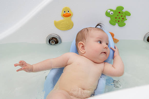 istock Newborn baby bathe and swim 543043508