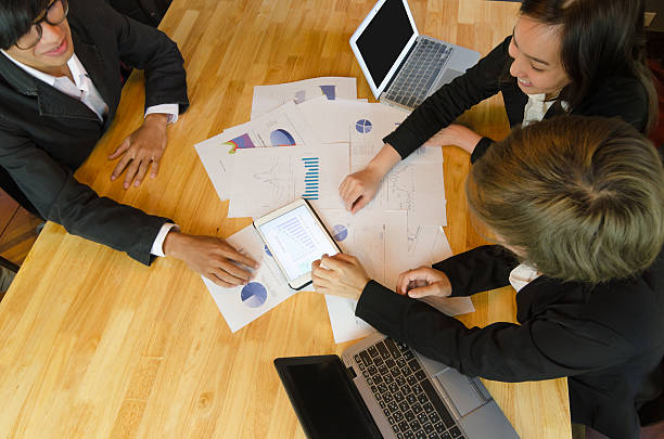 istock Business people group view graph in tablet for analysis business. 543043808