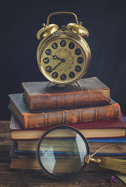 istock pile of books with clock 543044526