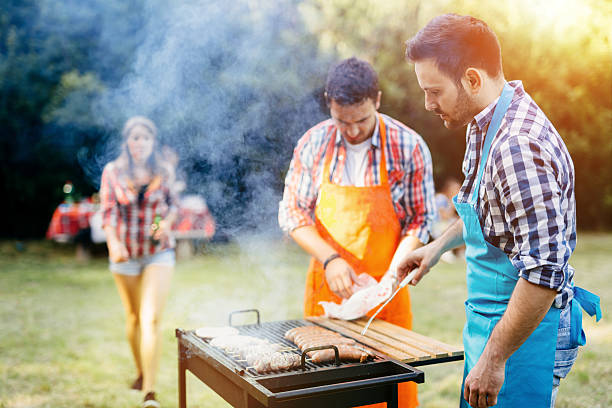 istock Young people grilling outdoors 543045970