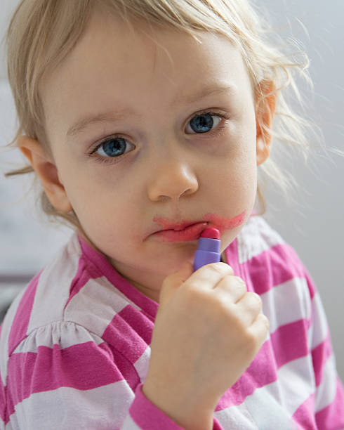 istock Child portrait with lipstick 543046680
