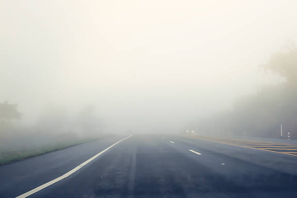 road in the fog. Thai road in the fog. Blurred, De-focused, soft focus. smog car stock pictures, royalty-free photos & images