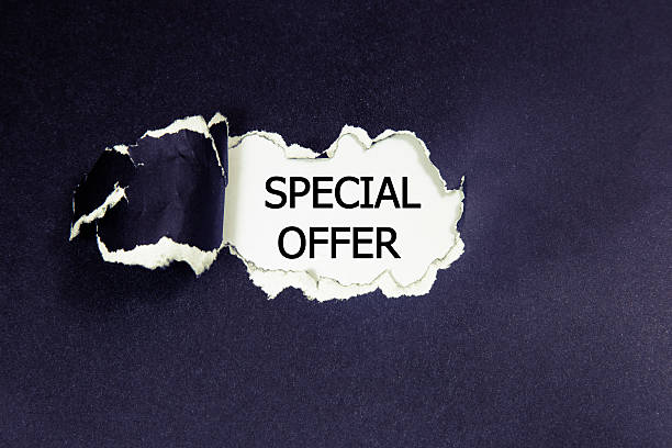 istock Special Offer appearing behind torn paper. 543048388