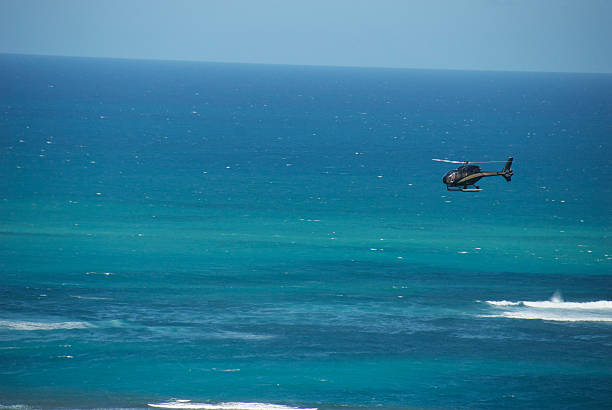 istock Helicopter flying by the Caribbean 543050774