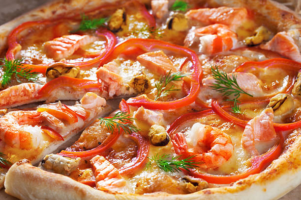 istock Pizza with salmon mussels, shrimp dill, close-up 543051668
