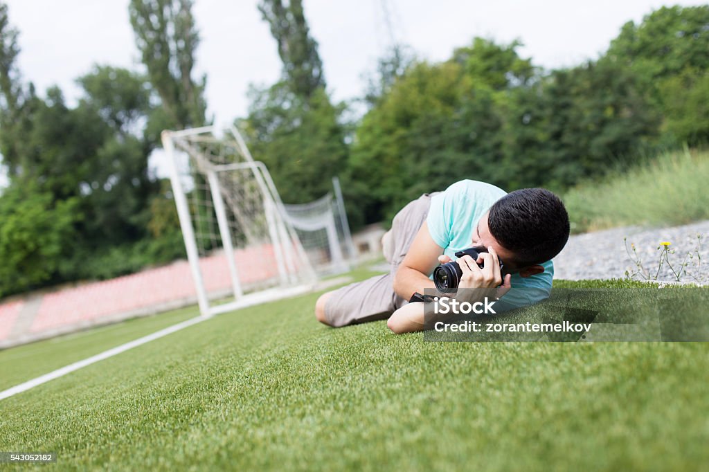 Photographer in action Sport  photographer shooting football match Soccer Stock Photo