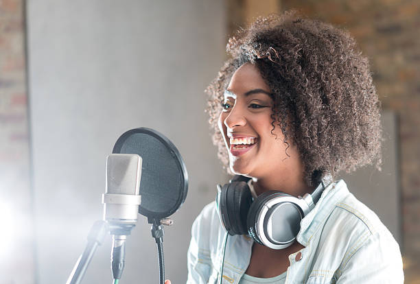 Happy woman at a recording studio