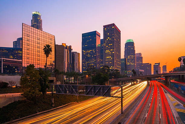 istock Los Angeles Downtown and Freeway at Dusk, Orange Purple Sky 543055134