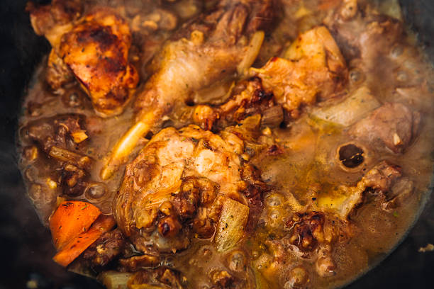 istock chicken in sauce with carrots on a pan closeup 543055478