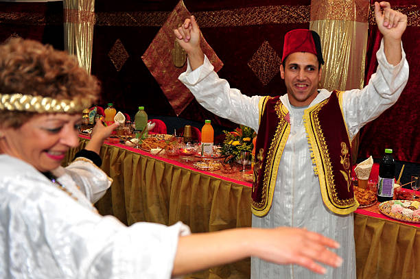 Sderot, Israel - April 5, 2010: Jewish people dance and celebrate the traditional North African Jewish celebration Mimouna held the day after the Jewish holiday of Passover in Jerusalem, Israel. It marks the start of spring and the return to eat leavened bread and bread by-products, which are forbidden throughout the week of Passover.