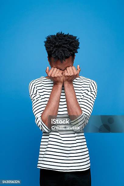 Afro American Guy Crying Stock Photo - Download Image Now - Colored Background, Fashionable, Pain