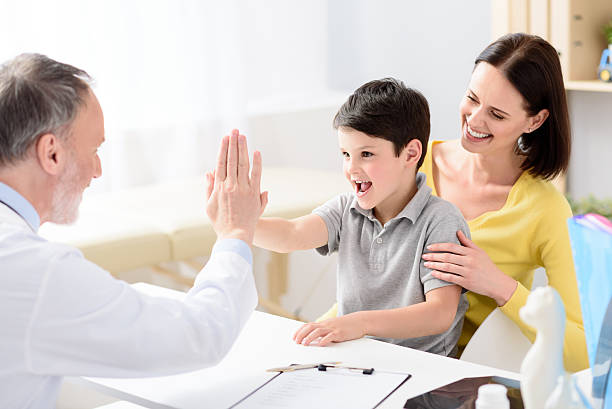 istock Pediatrician doctor examining child 543059600