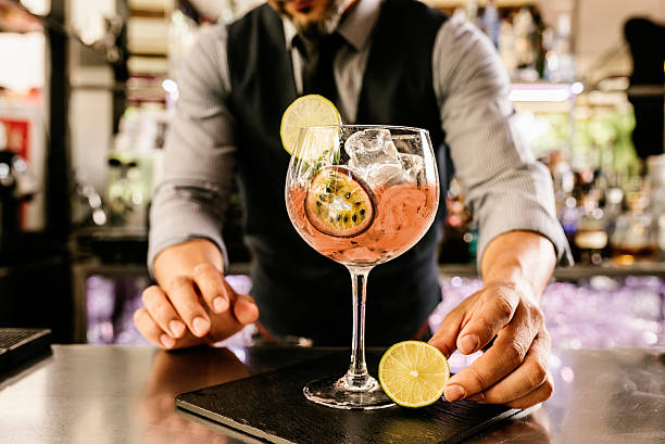 istock Barman is making cocktail at night club. 543059796