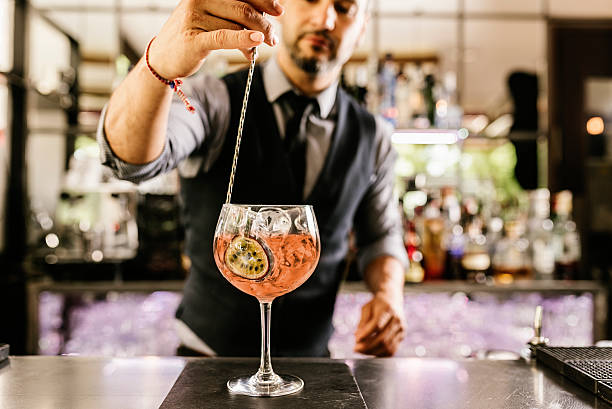 istock Barman is making cocktail at night club. 543059874