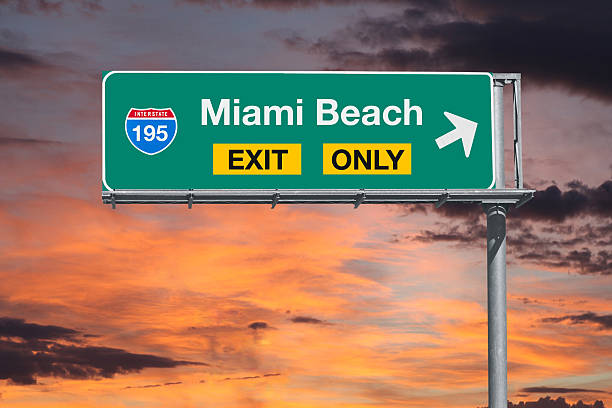 istock Miami Beach Exit Only Highway Sign with Sunrise Sky 543061726