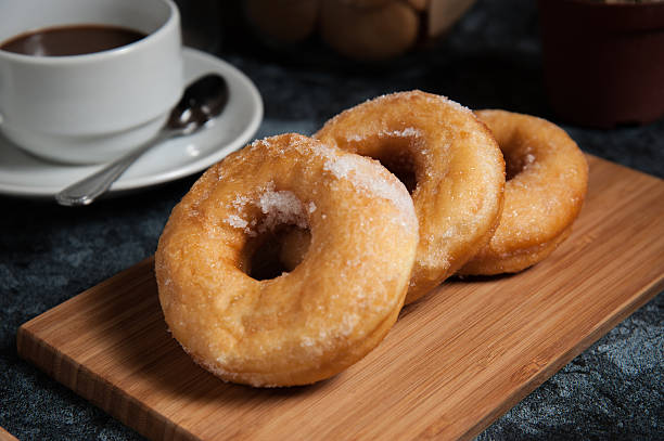 istock Delicious donuts with icing and cup of coffee 543061924