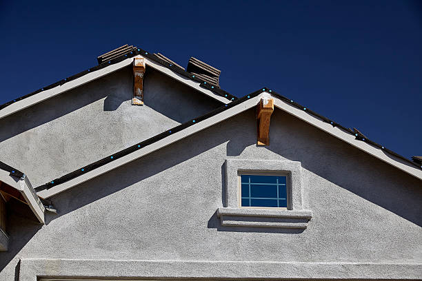 New home construction double gable roof and stucco New home construction double gable roof and stucco gable stock pictures, royalty-free photos & images