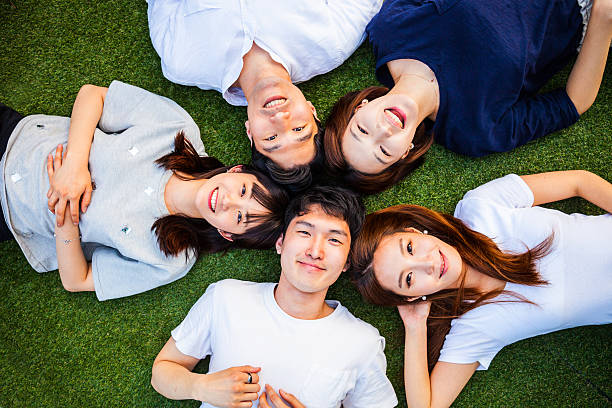 istock Korean friends having fun and relaxing on the grass 543065948