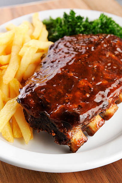 istock Grilled barbecue ribs and fries 543066688