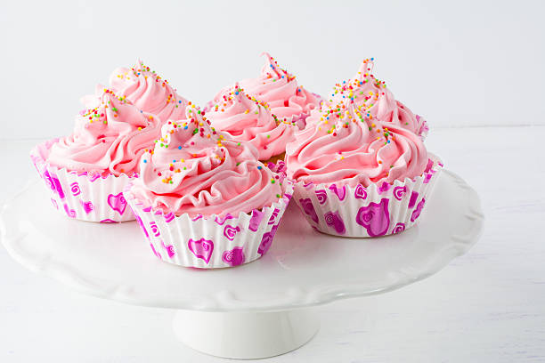 istock Decorated pink birthday cupcakes  on the cake stand 543066974