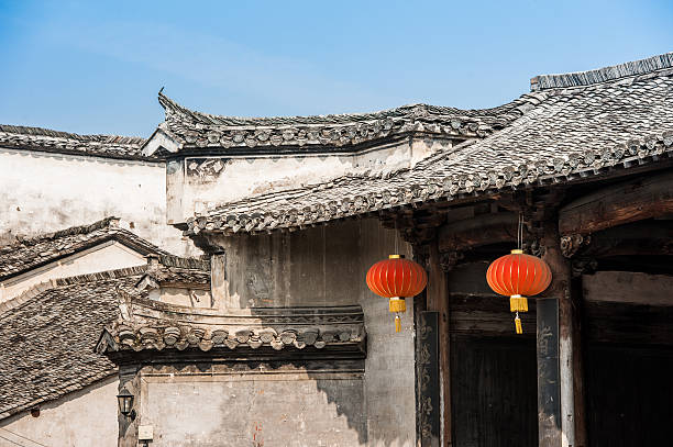 istock White buildings with red lanterns. Hongcun Village, China 543067636