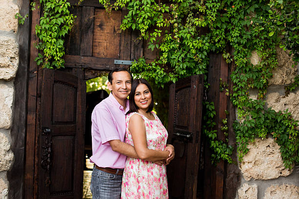 istock Latin mature man embracing wife from behind 543067816