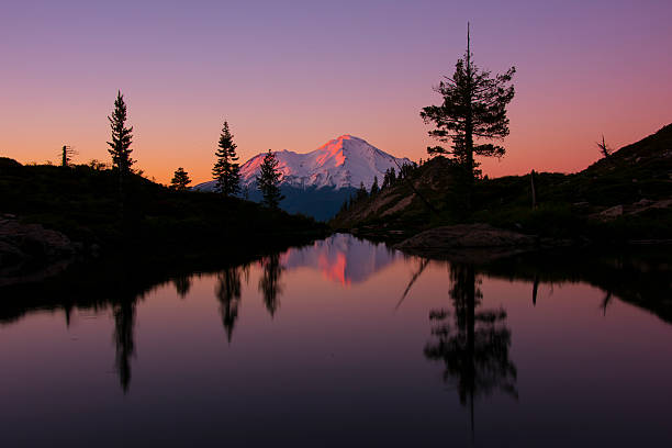 Mt. Shasta sunset reflection. Mt. Shasta reflected in the lake during sunset. mt shasta stock pictures, royalty-free photos & images