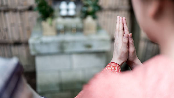 istock Woman put her hands together and praying 543069690