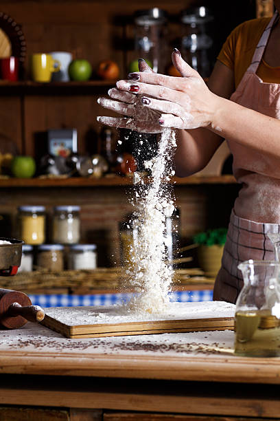 istock Close up of female baker hands kneading dough 543074092