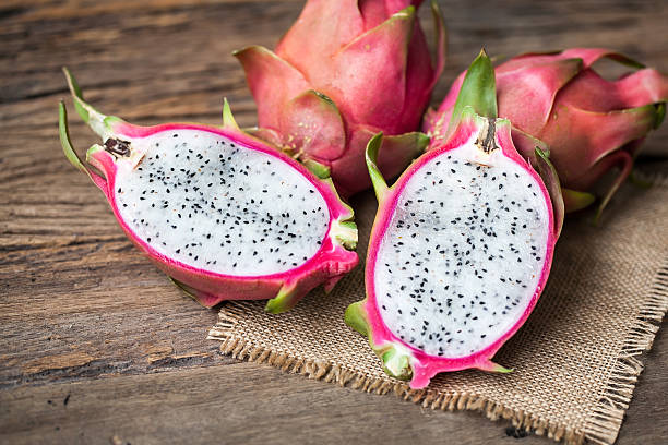 istock Dragon Fruit on the wooden background 543074394